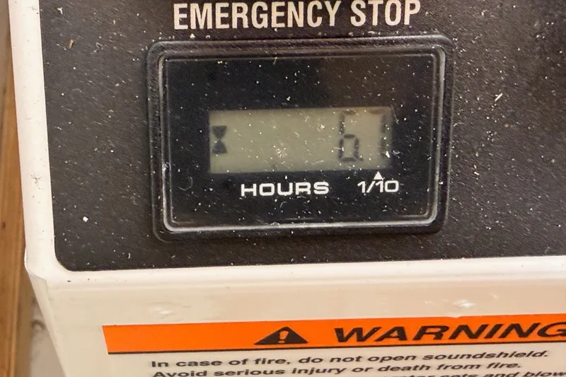Slide: The Image of Emergency stop panel with hour meter on 2009 Jeanneau Sun Odyssey 45 DS sailboat. - 100