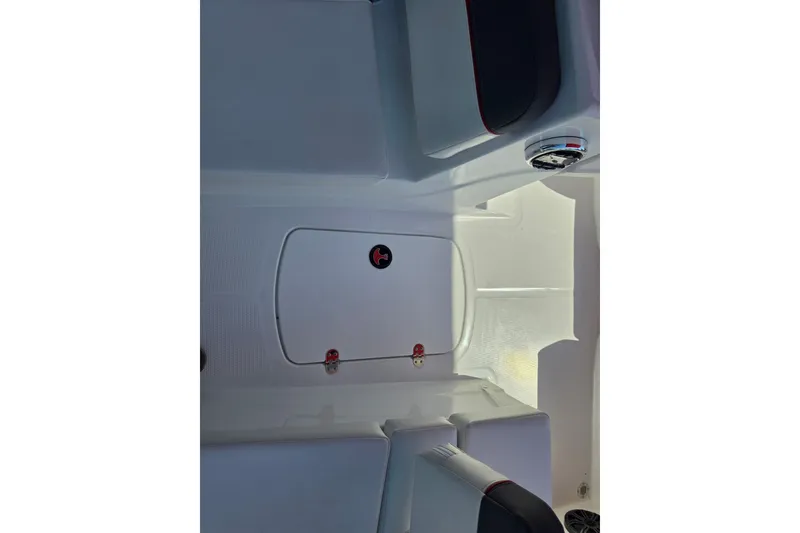 Slide: The Image of Interior view of 2027 Tahoe T16 boat, featuring sleek white seating and storage compartment. - 8