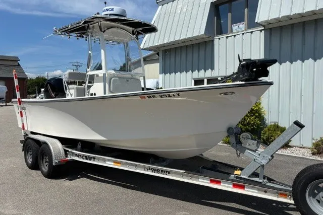 Slide: The Image of A 2023 May-Craft 20 Cape Classic boat on a trailer, ready for transport. - 2