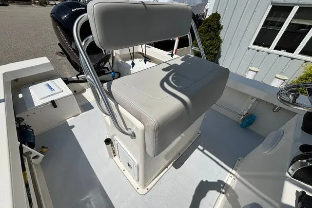 Slide: The Image of The image shows the cockpit of a 2023 May-Craft 20 Cape Classic boat with a cushioned seat. - 11