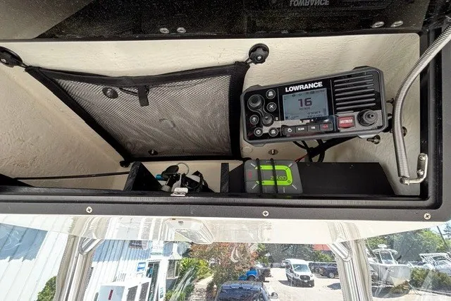Slide: The Image of The image shows the dashboard of a May-Craft 20 Cape Classic boat with a Lowrance radio. - 15