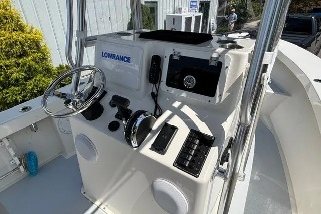 Slide: The Image of The image shows the helm of a 2023 May-Craft 20 Cape Classic boat with navigation equipment. - 7