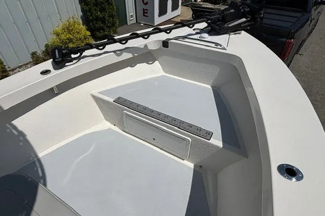 Slide: The Image of The image shows the bow of a 2023 May-Craft 20 Cape Classic boat with a fishing rod holder. - 6