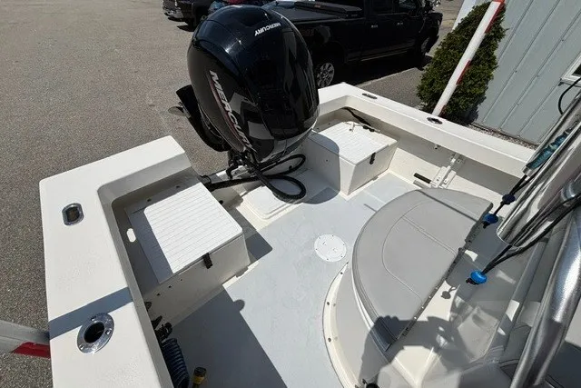 Slide: The Image of The image shows the stern of a 2023 May-Craft 20 Cape Classic boat with an outboard motor. - 12