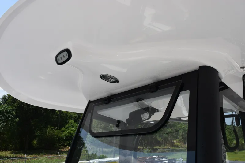 Slide: The Image of 2027 Sea Hunt Gamefish 25 boat's T-top with integrated lighting and sleek design. - 14