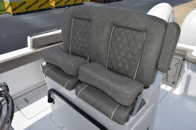 Slide: The Image of 2027 Sea Hunt Gamefish 25 boat seats with gray upholstery and diamond stitching. - 17