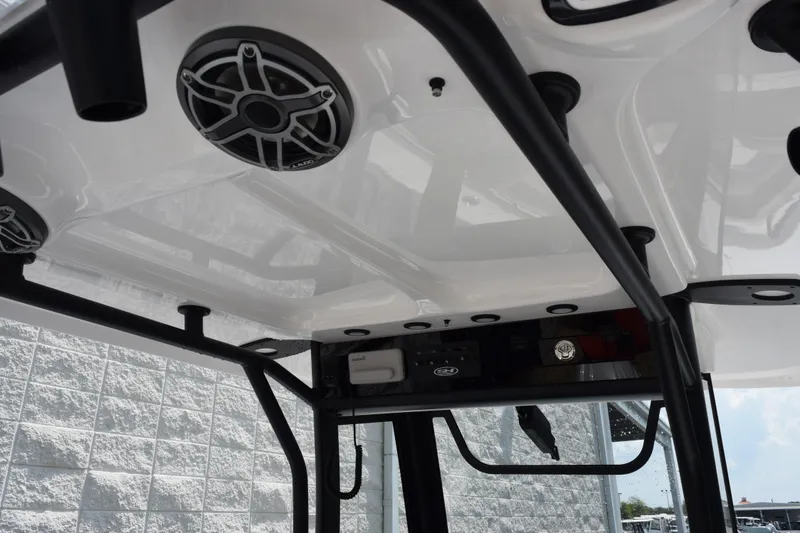 Slide: The Image of 2027 Sea Hunt Gamefish 25 boat interior with speakers and rod holders. - 10