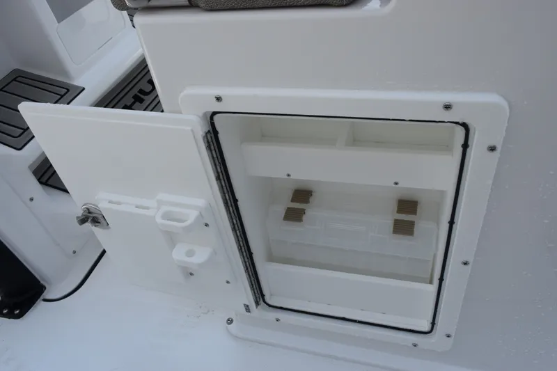 Slide: The Image of Open storage compartment on a 2027 Sea Hunt Gamefish 25 boat. - 18