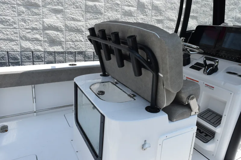 Slide: The Image of 2027 Sea Hunt Gamefish 25 boat interior with seating and control panel. - 8