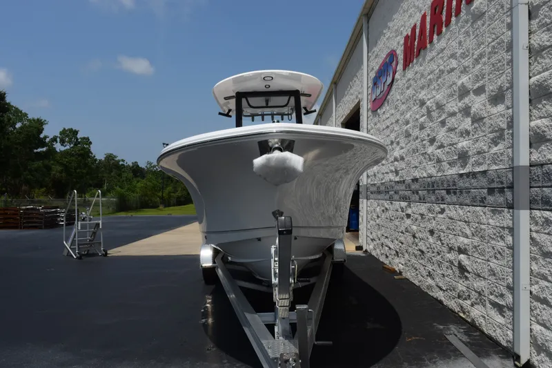 Slide: The Image of 2027 Sea Hunt Gamefish 25 boat on trailer outside marine dealership. - 3