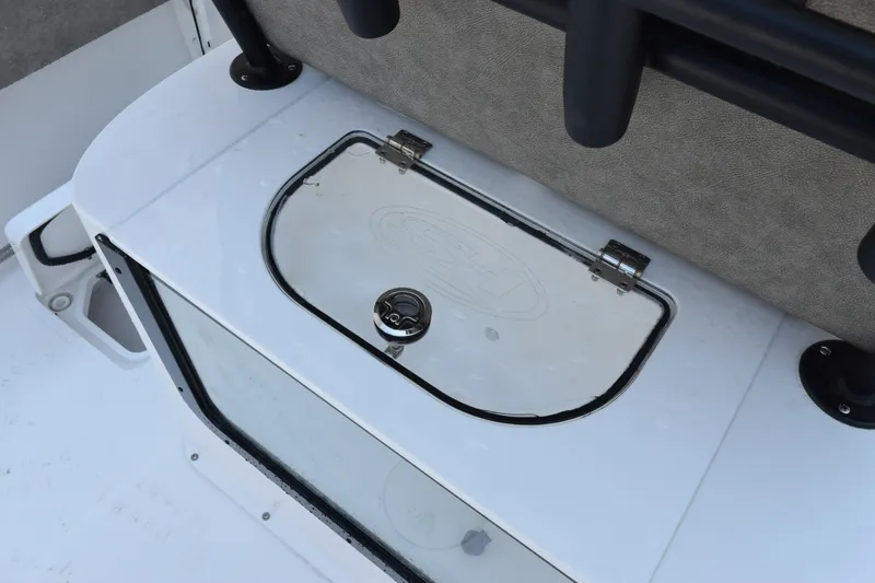 Slide: The Image of Livewell compartment on a 2027 Sea Hunt Gamefish 25 boat, featuring a secure latch. - 22