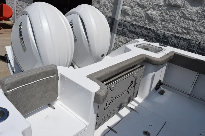 Slide: The Image of 2027 Sea Hunt Gamefish 25 boat with dual Yamaha engines, featuring a sleek, modern design. - 7