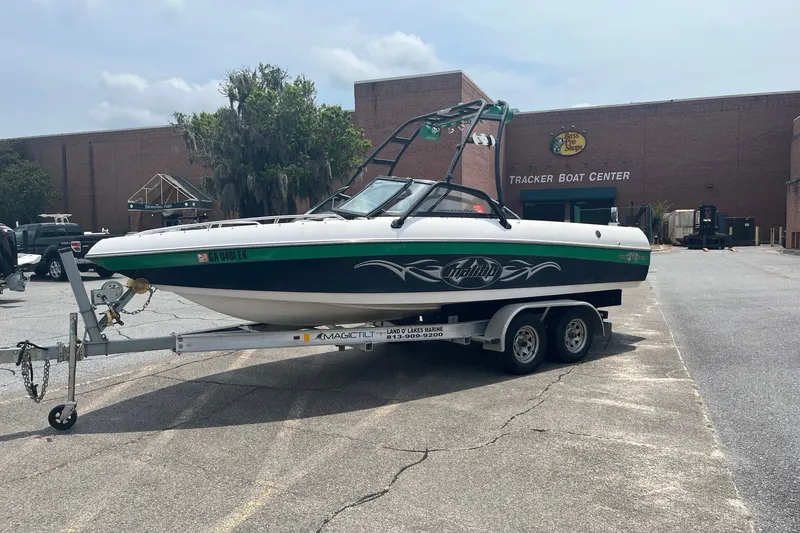 Slide: The Image of 2003 Malibu Wakesetter boat on trailer outside Tracker Boat Center. - 1