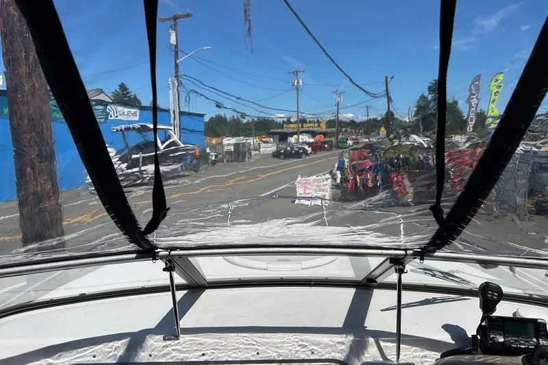 Slide: The Image of View from a 2002 Four Winns 225 Sundowner boat through a clear windshield. - 14