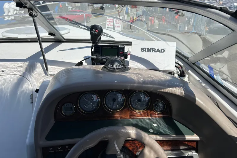 Slide: The Image of Dashboard of a 2002 Four Winns 225 Sundowner boat with Simrad navigation system. - 9