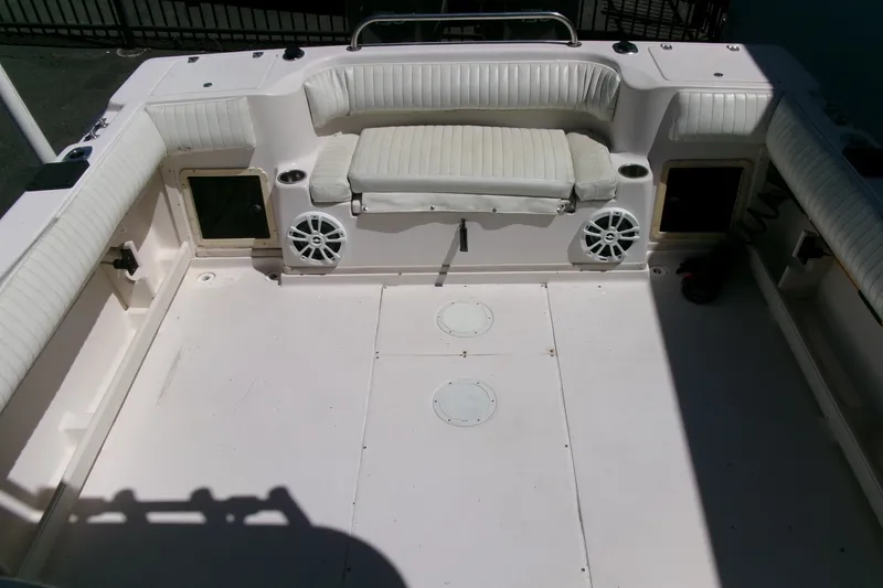 Slide: The Image of 2001 Grady-White Gulfstream 232 boat interior with white seating and speakers. - 22