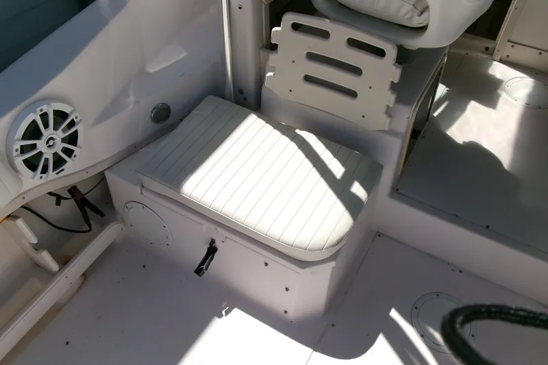 Slide: The Image of 2001 Grady-White Gulfstream 232 boat interior with cushioned seating and speaker. - 18