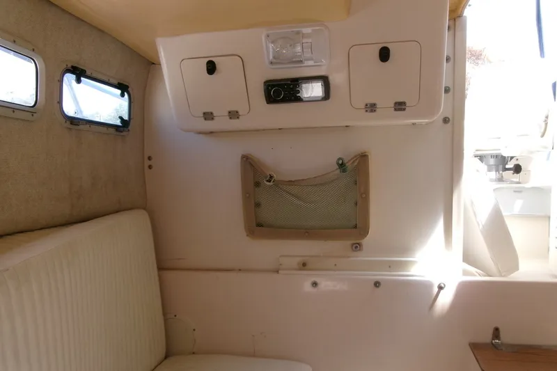 Slide: The Image of Interior cabin of 2001 Grady-White Gulfstream 232 boat with seating and storage compartments. - 14