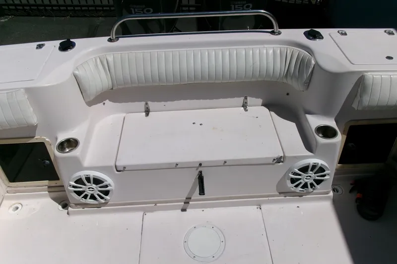 Slide: The Image of 2001 Grady-White Gulfstream 232 boat interior with seating and speakers. - 23