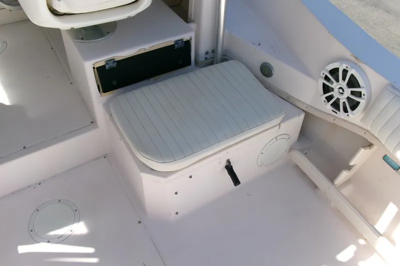 Slide: The Image of 2001 Grady-White Gulfstream 232 boat interior with cushioned seating and speaker. - 20