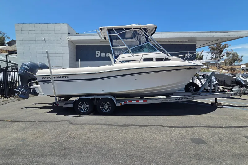 The Image of 2001 Grady-White Gulfstream 232 boat on trailer, parked outdoors. - 0