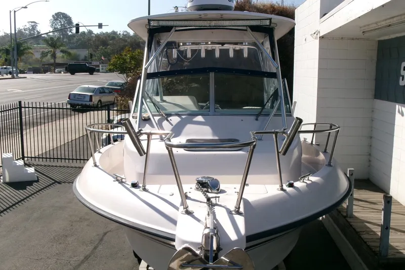 Slide: The Image of 2001 Grady-White Gulfstream 232 boat parked near a street, front view. - 27