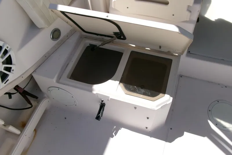 Slide: The Image of Open storage compartment on a 2001 Grady-White Gulfstream 232 boat deck. - 19