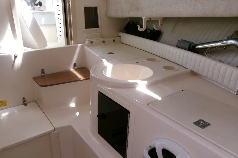Slide: The Image of Interior of 2001 Grady-White Gulfstream 232 boat, featuring seating and storage areas. - 16