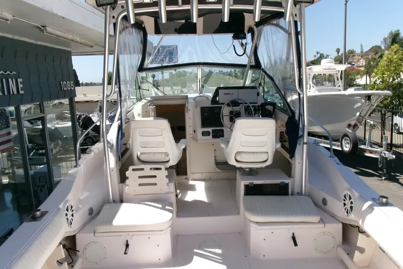Slide: The Image of 2001 Grady-White Gulfstream 232 boat interior with helm and seating area. - 17