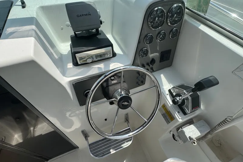 Slide: The Image of Steering console of a 2002 Wellcraft 220 Coastal boat with Garmin GPS and gauges. - 8