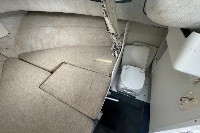 Slide: The Image of Interior cabin of 2002 Wellcraft 220 Coastal boat with seating and compact toilet. - 19