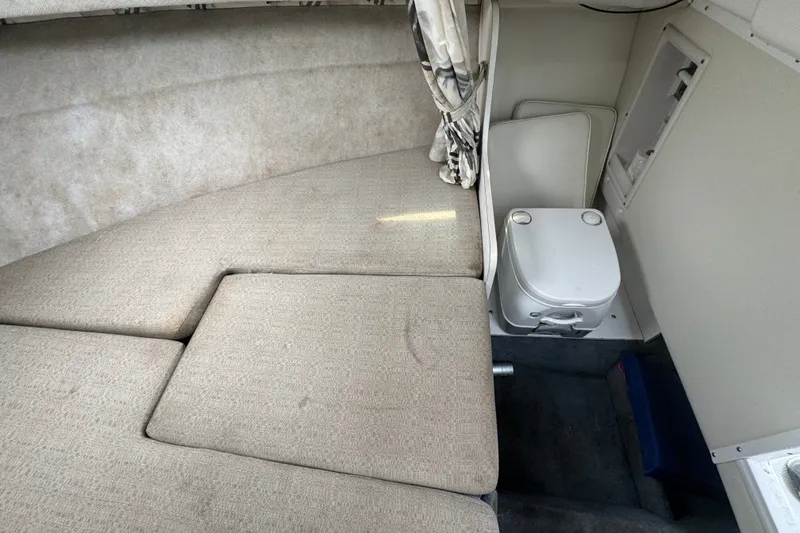 Slide: The Image of Interior cabin of 2002 Wellcraft 220 Coastal boat with seating and portable toilet. - 20