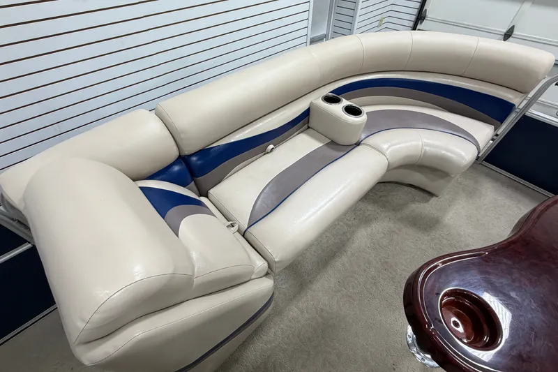 Slide: The Image of Luxurious seating on a 2012 South Bay 522 SL pontoon boat with cup holders. - 23
