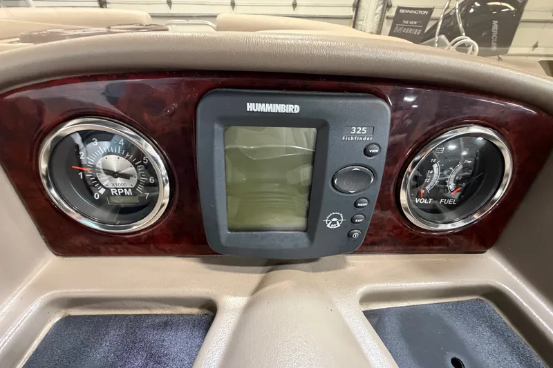 Slide: The Image of Dashboard of a 2012 South Bay 522 SL with RPM and volt/fuel gauges. - 17