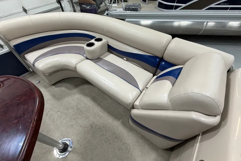 Slide: The Image of Luxurious seating on a 2012 South Bay 522 SL pontoon boat with cup holders and elegant design. - 24