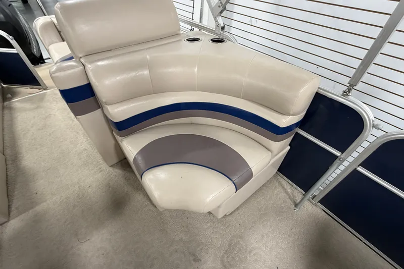 Slide: The Image of 2012 South Bay 522 SL boat seating with beige, blue, and gray upholstery. - 13