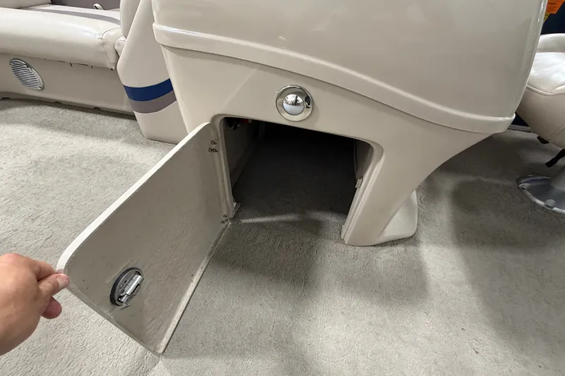 Slide: The Image of Open storage compartment on 2012 South Bay 522 SL boat interior. - 27
