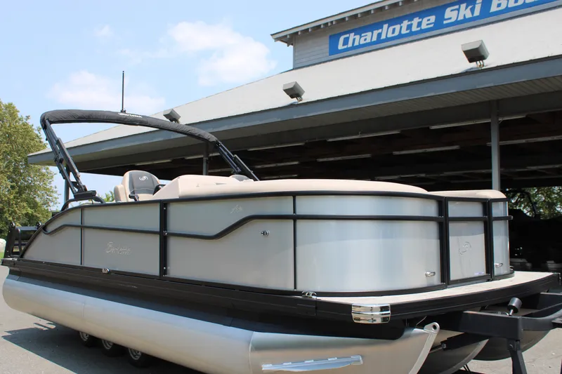 Slide: The Image of 2027 Barletta ARIA 22UC pontoon boat displayed at Charlotte Ski Boats dealership. - 2