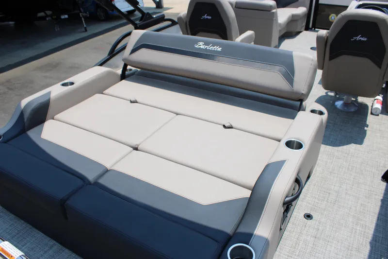 Slide: The Image of 2027 Barletta ARIA 22UC boat interior with luxurious seating and cup holders. - 14