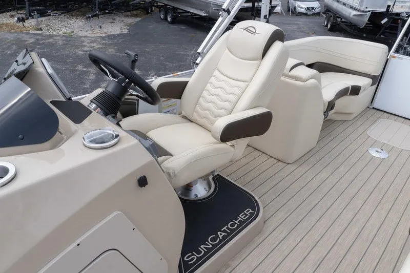 Slide: The Image of Luxurious SunCatcher Fusion 324RC boat interior with plush seating, 2026 model. - 24