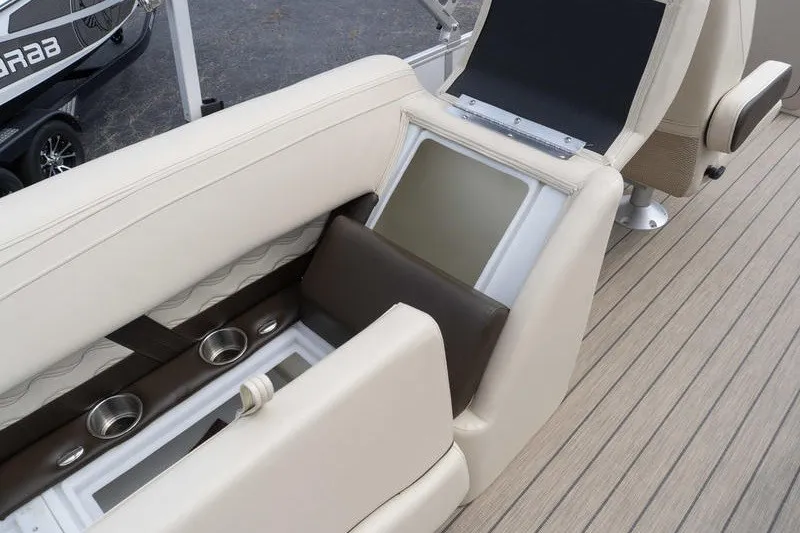 Slide: The Image of Luxury seating and storage on 2026 SunCatcher Fusion 324RC boat, featuring cup holders and sleek design. - 31