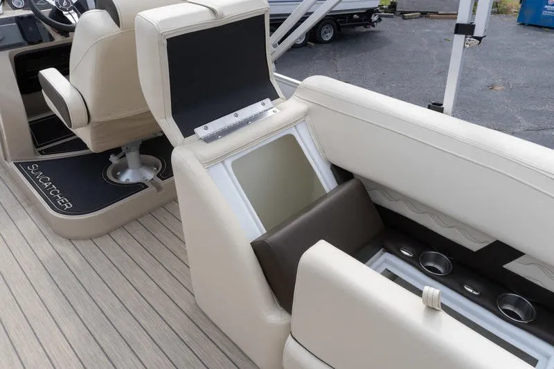 Slide: The Image of Interior of 2026 SunCatcher Fusion 324RC boat with open storage compartment. - 33