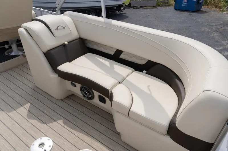 Slide: The Image of Luxurious seating on 2026 SunCatcher Fusion 324RC boat, featuring beige and brown upholstery. - 32