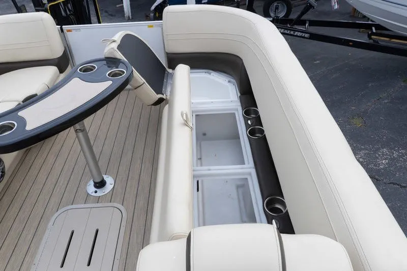 Slide: The Image of Luxurious SunCatcher Fusion 324RC boat interior with seating and storage, 2026 model. - 19
