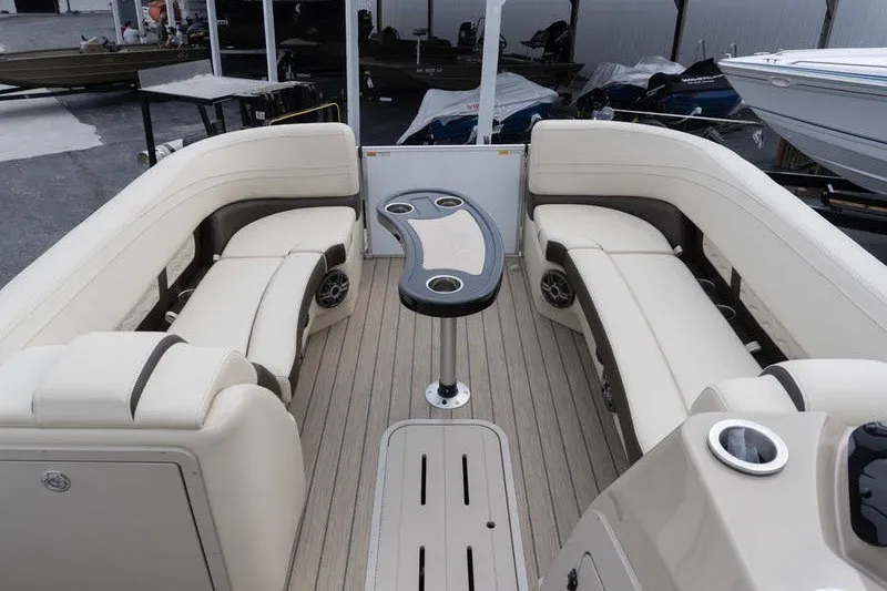 Slide: The Image of Luxurious seating area on 2026 SunCatcher Fusion 324RC pontoon boat with modern design. - 17