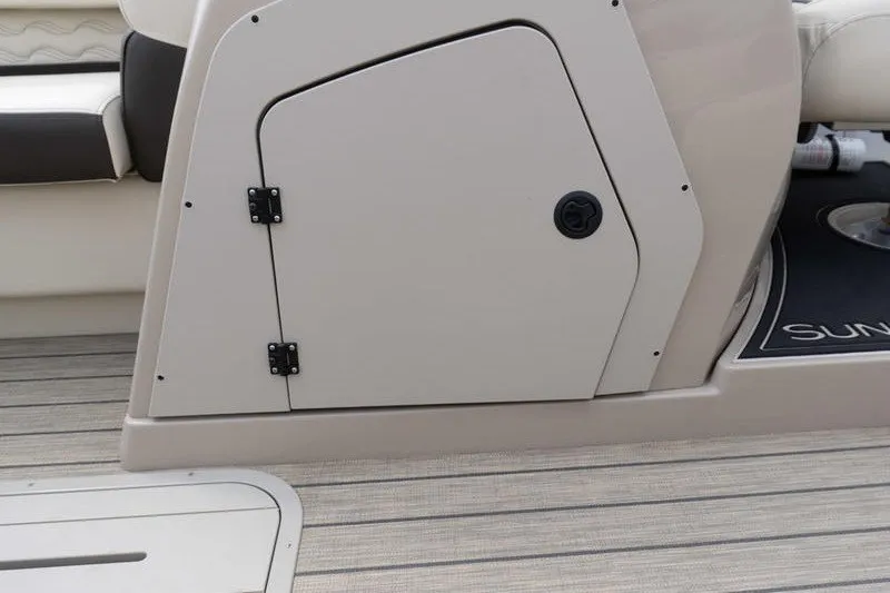 Slide: The Image of 2026 SunCatcher Fusion 324RC boat interior with storage compartment and seating. - 15