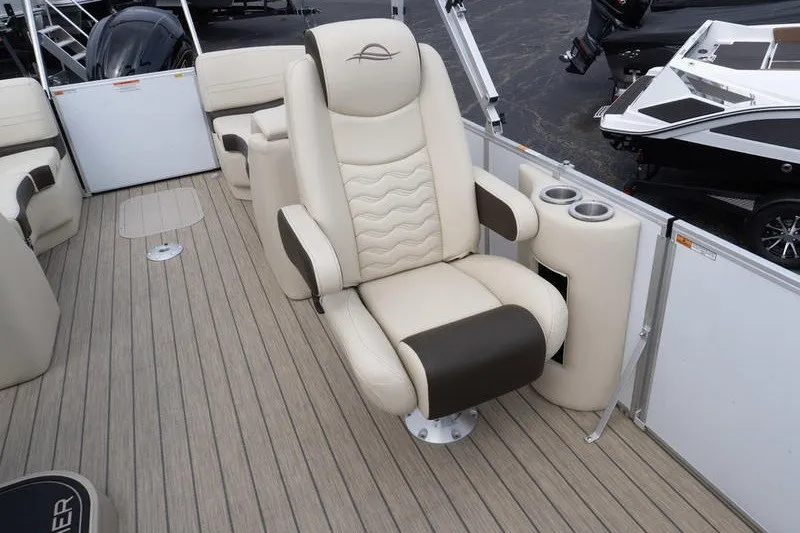 Slide: The Image of Luxurious seating on 2026 SunCatcher Fusion 324RC boat, featuring cup holders and modern design. - 25