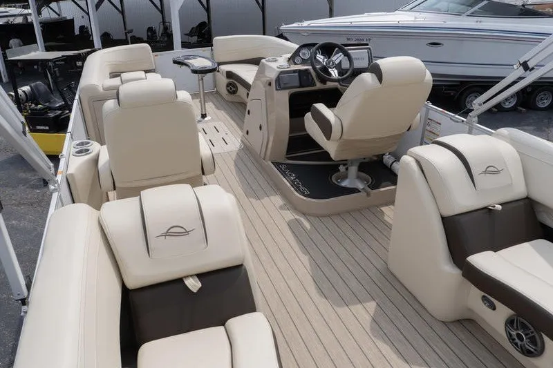 Slide: The Image of 2026 SunCatcher Fusion 324RC pontoon boat interior with luxurious seating and modern helm. - 8