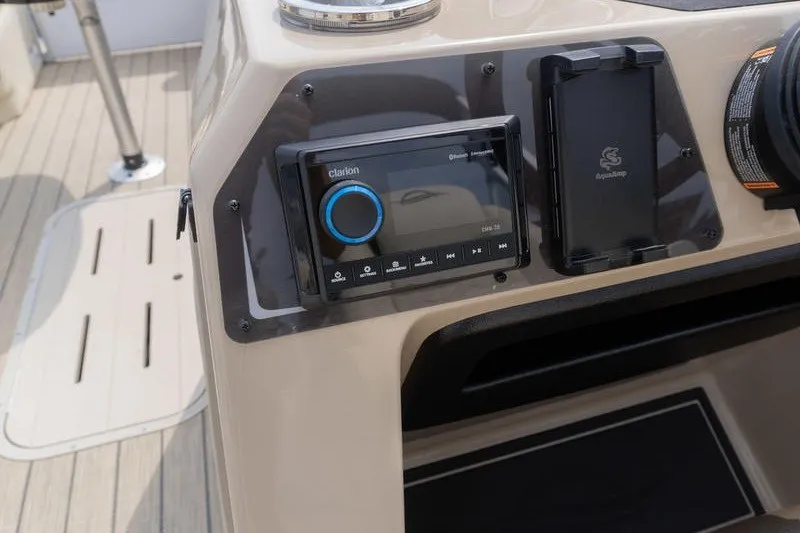 Slide: The Image of Control panel of 2026 SunCatcher Fusion 324RC boat with audio system. - 11