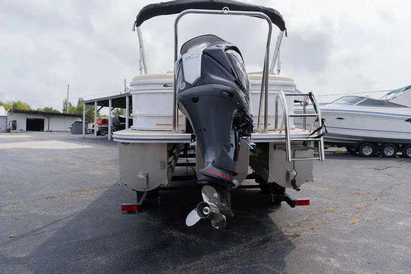 Slide: The Image of Rear view of 2026 SunCatcher Fusion 324RC boat with outboard motor. - 6